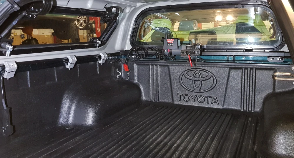 Držák navijáku do korby